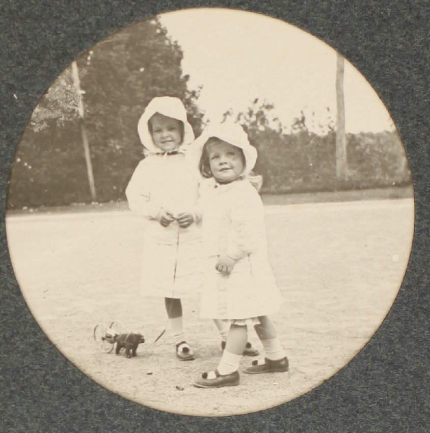 [Two Children and a toy]