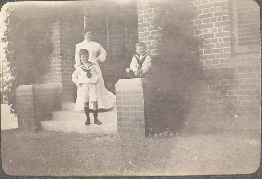 [A woman and two boys]