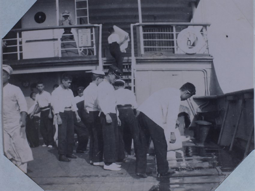 Washing the deck on the Kumano Maru
