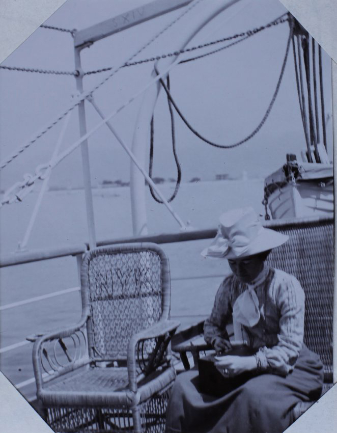 A woman and a wicker chair