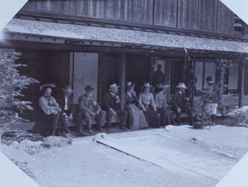 The tour party on a verandah