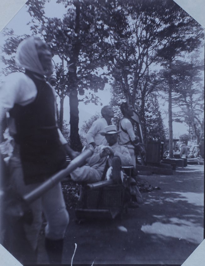 Man in a sedan chair