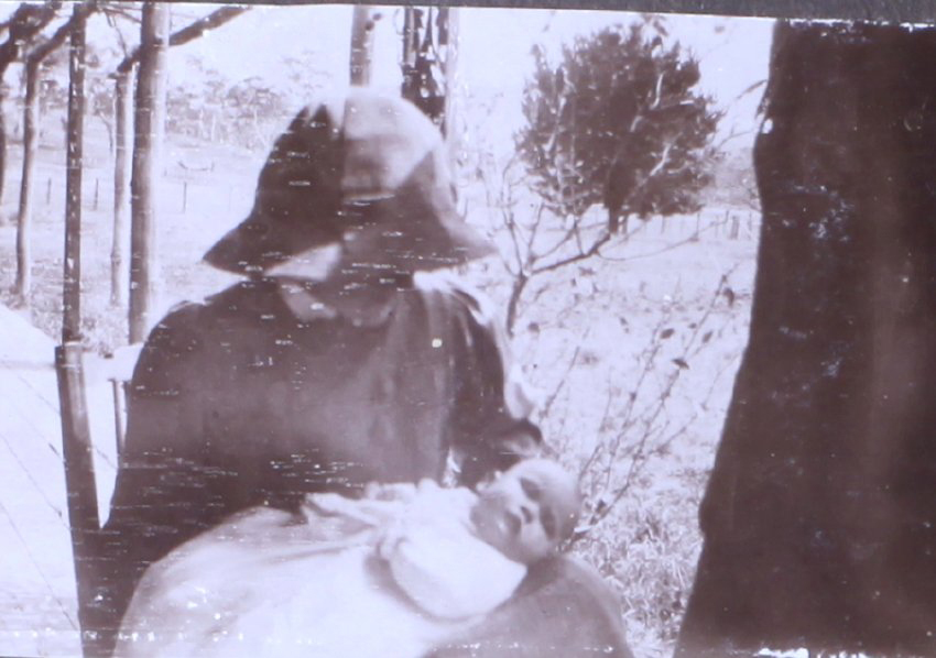 Unidentified woman and baby