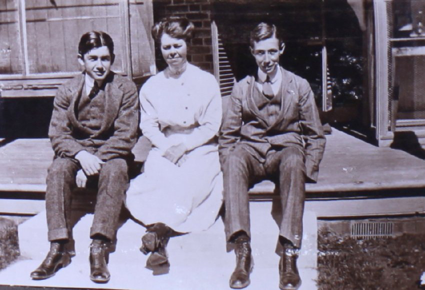 Unidentified woman and two young men
