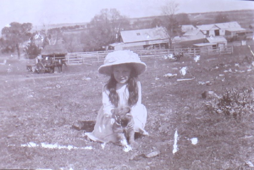 Unidentified girl with a pet dog