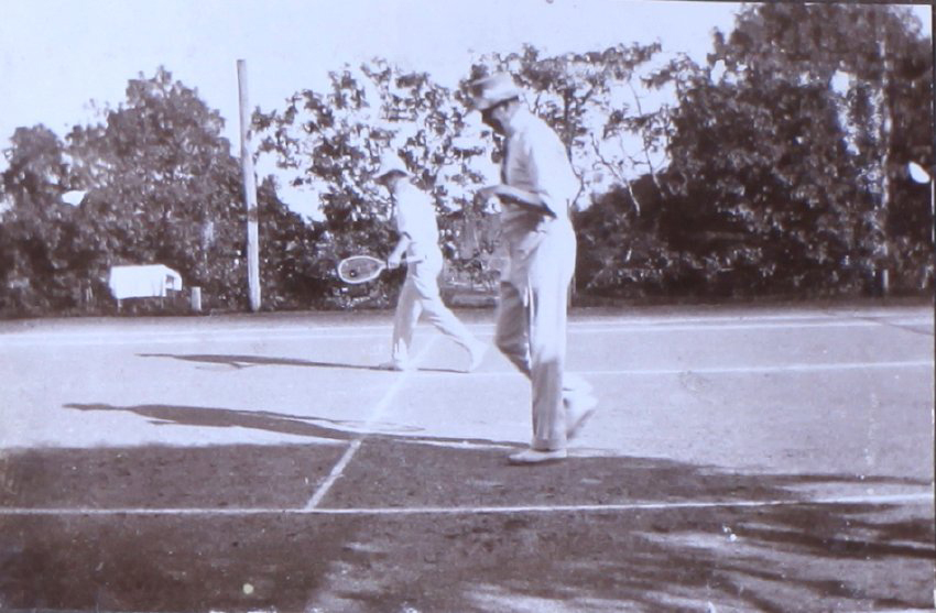 Two unidentified man playing tennis
