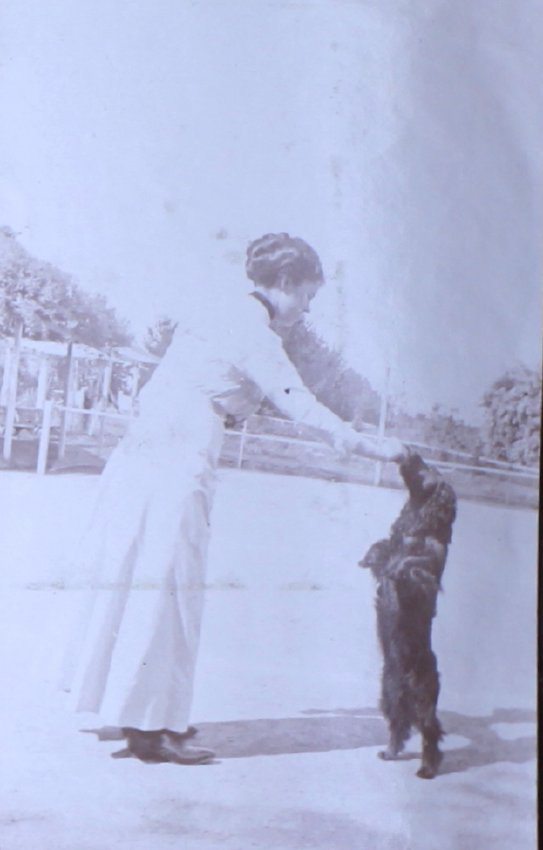 Unidentified woman with pet dog