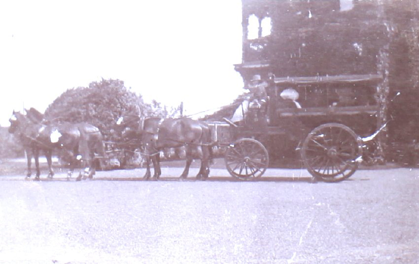 Four horse carriage with unidentified occupants