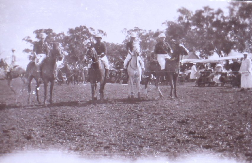Four unidentified polo players on horseback