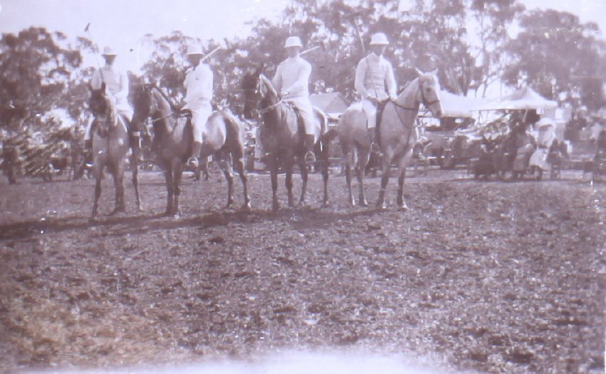 Four unidentified polo players on horseback