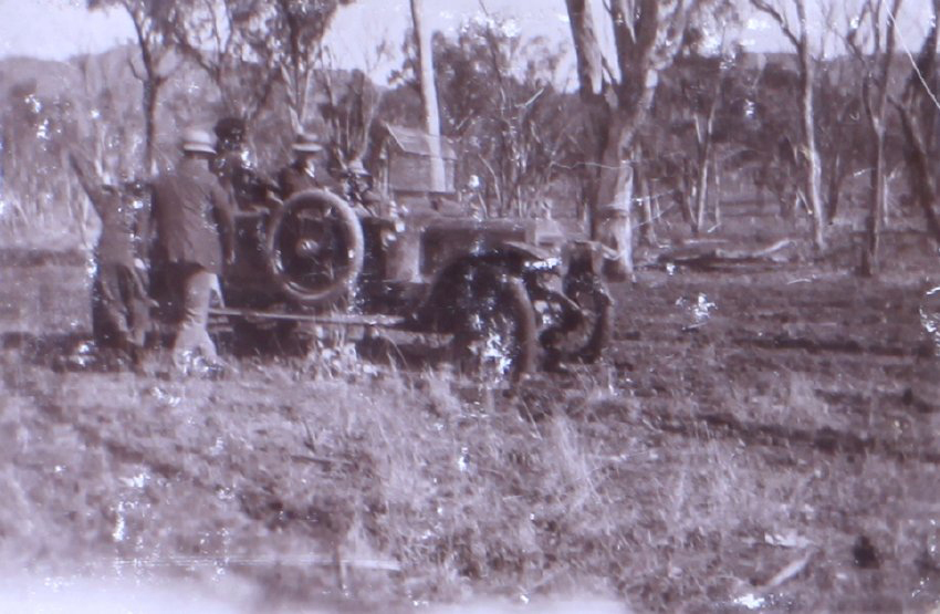Unidentified men with a car