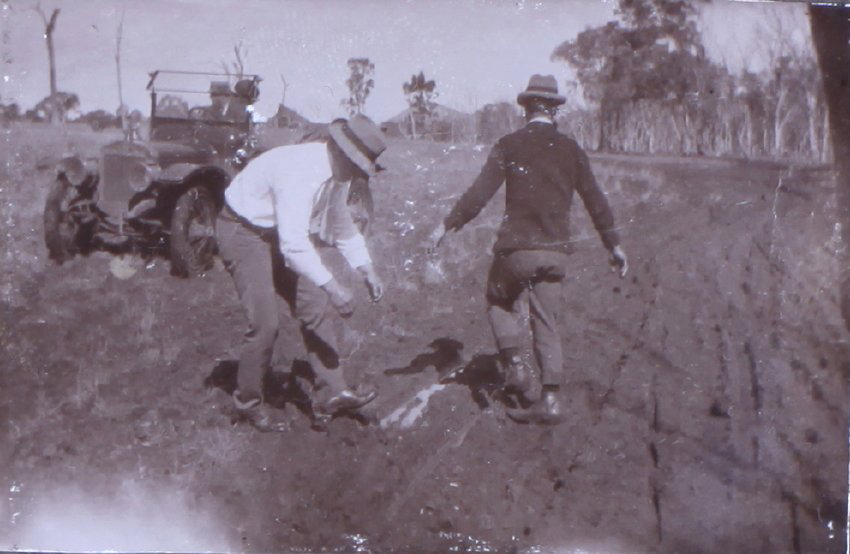 Two unidentified men in the mud