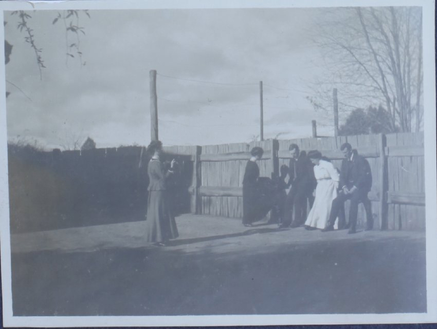 Five unidentified people on a tennis court