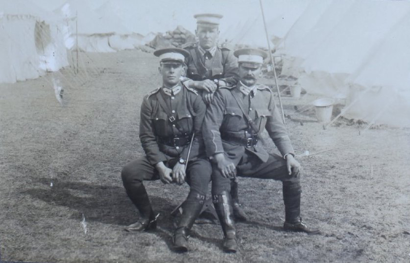 Three officers [Camp at Armidale Showgrounds]