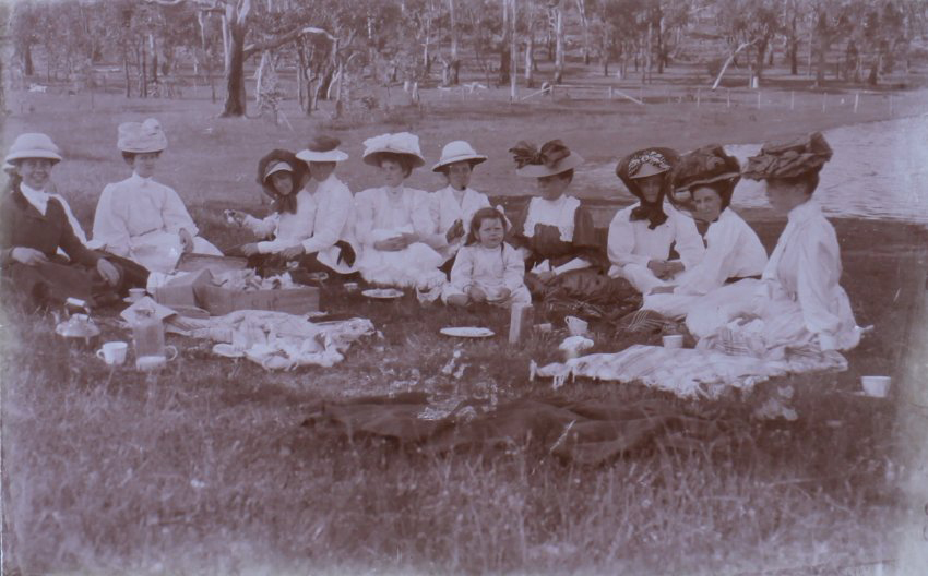 Group of ten women and one child on a picnic