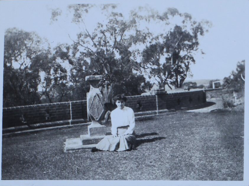Woman sitting in front of a sundial