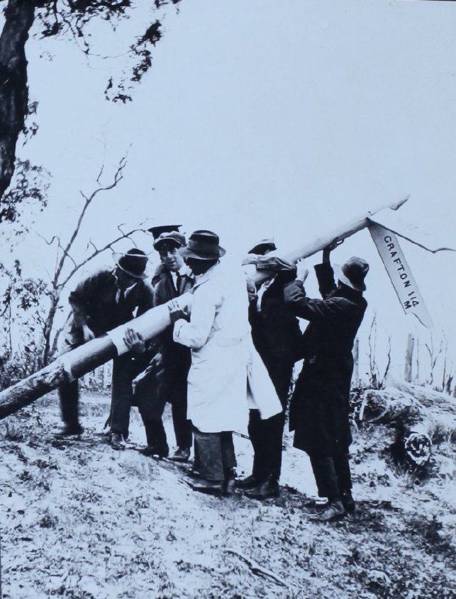 Group of men with the Metz sign, east of Armidale, NSW