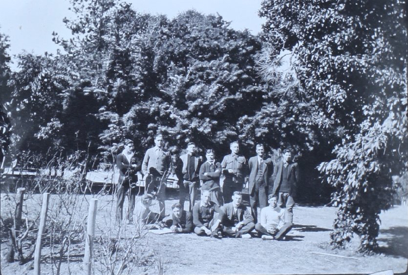 Group of twelve man in the gardens