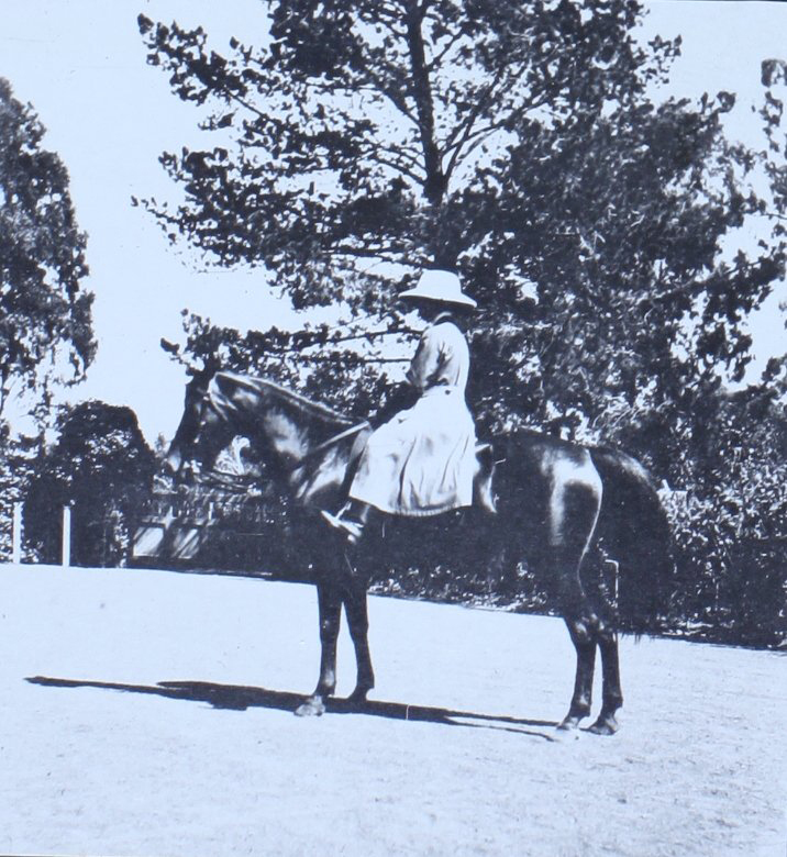 Woman on horseback in the gardens