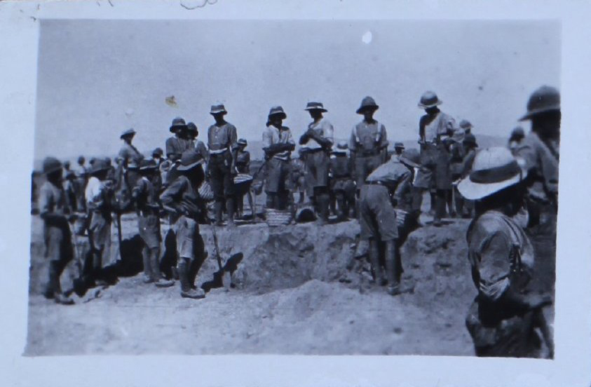 Soldiers digging in the desert