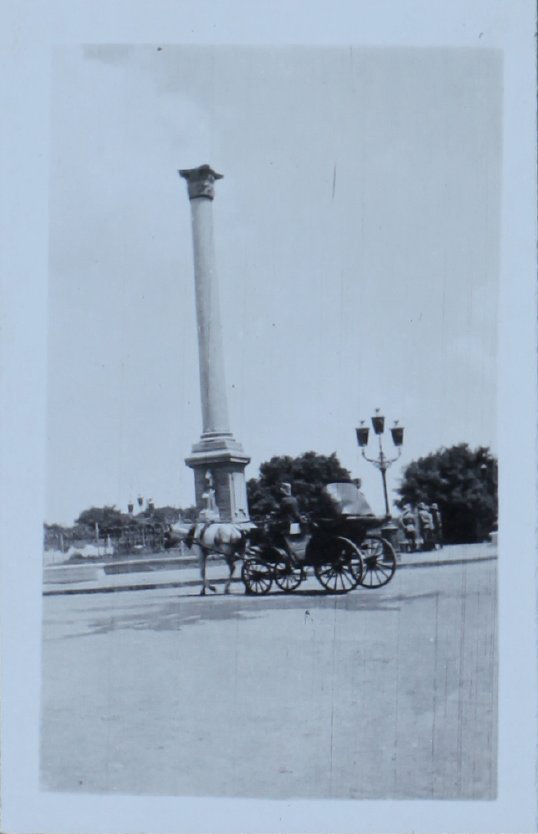 Column with a horse and buggy in the foreground