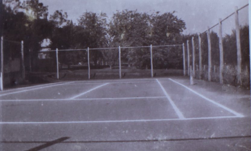 Tennis court and gardens at Saumarez