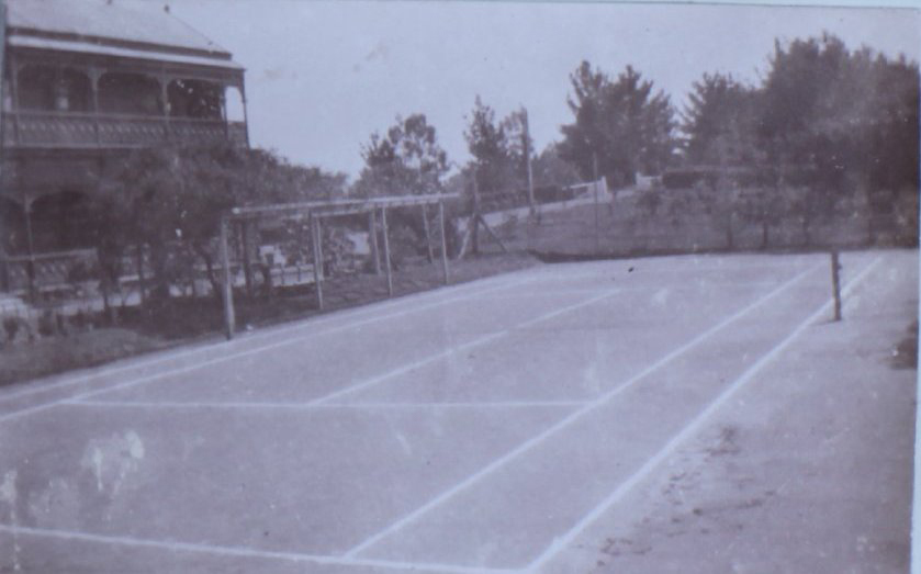 Tennis court and gardens at Saumarez