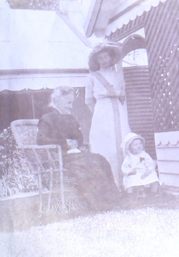 Two unidentified women and child