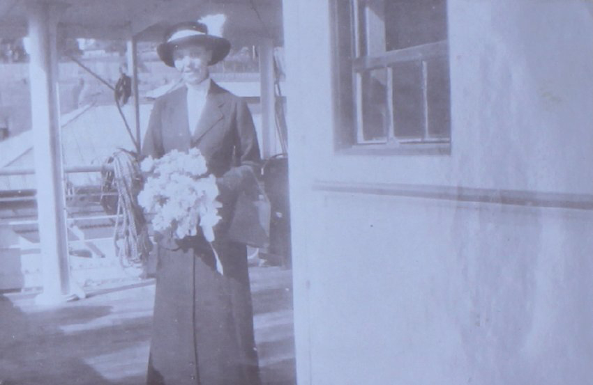 Unidentified woman holding flowers