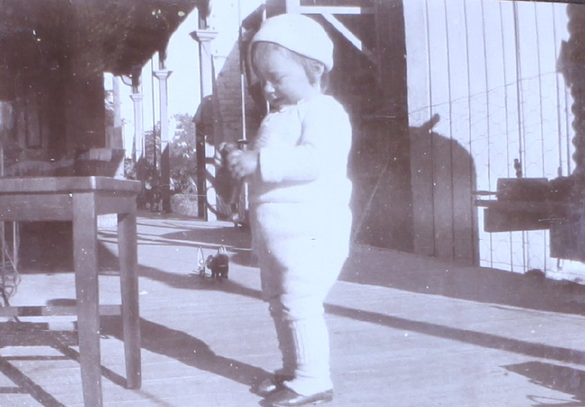 Unidentified child on verandah