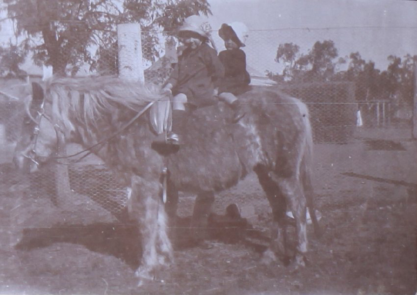 Unidentified children on a pony