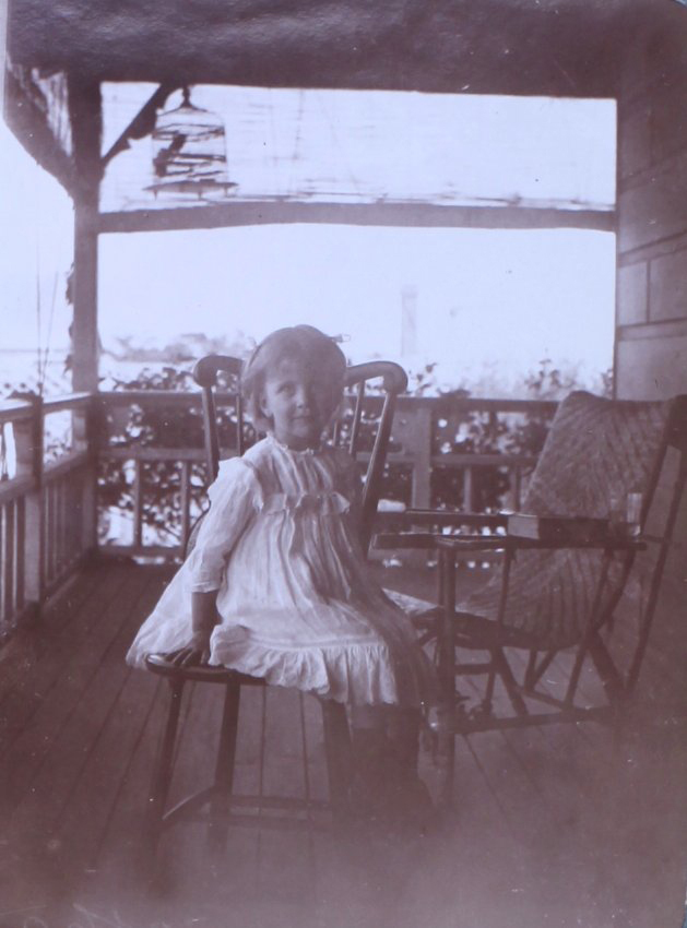 Unidentified girl on verandah