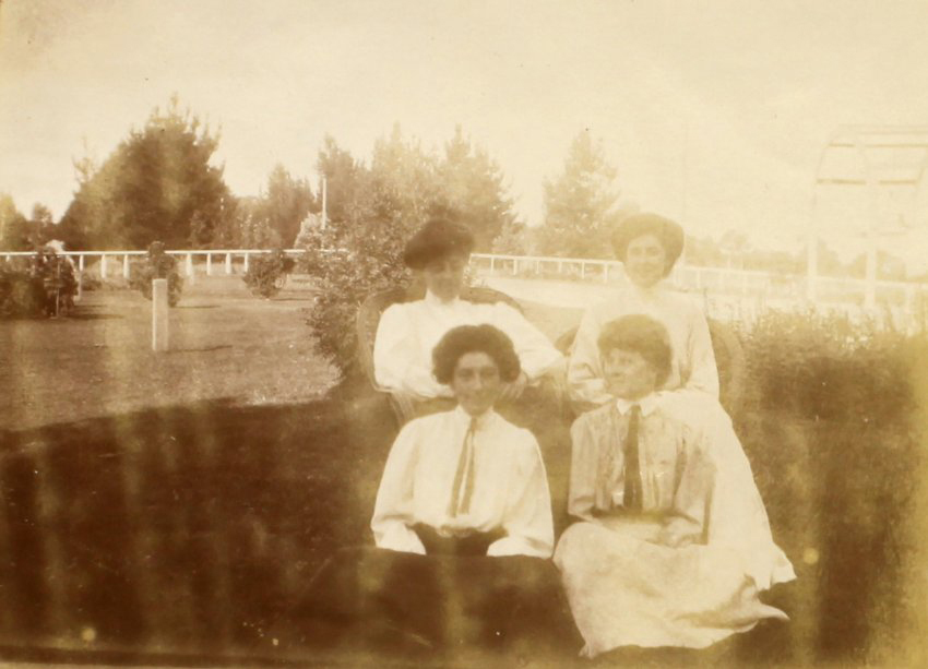 Four unidentified women in a garden