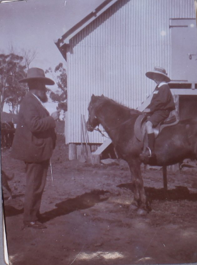 Unidentified man with bay on horseback