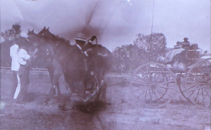 Unidentified men with a horse and buggy