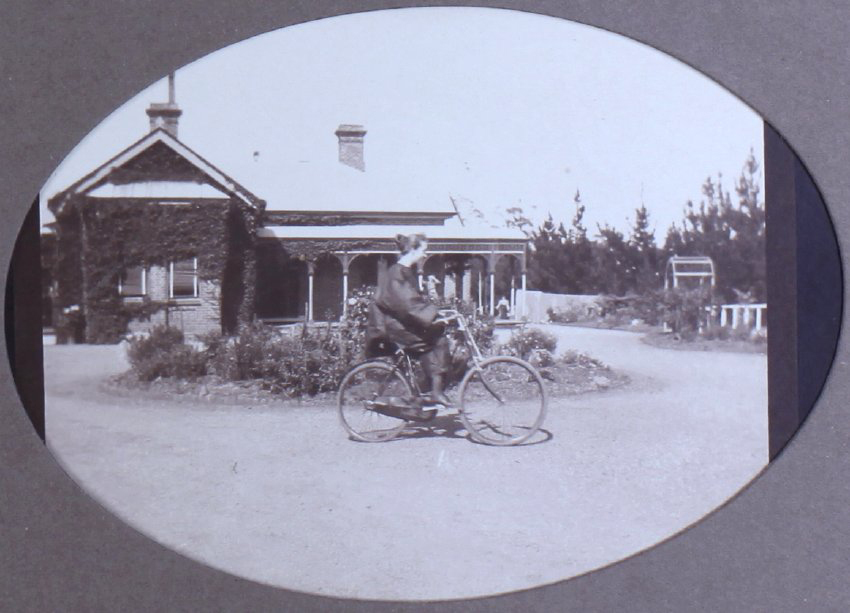 Unidentified woman on a bicycle