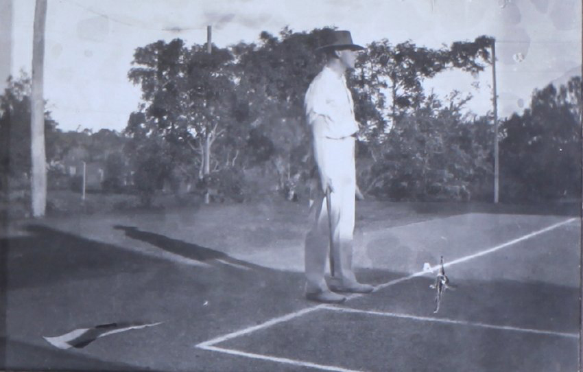 Unidentified man on a tennis court
