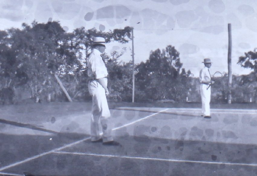 Two unidentified men on a tennis court