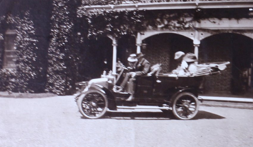 Unidentified men and women in a car
