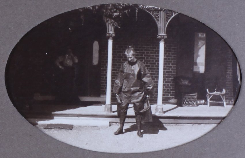 Unidentified woman in plastic [?] clothes