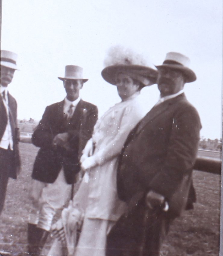 Unidentified group of three men and one woman