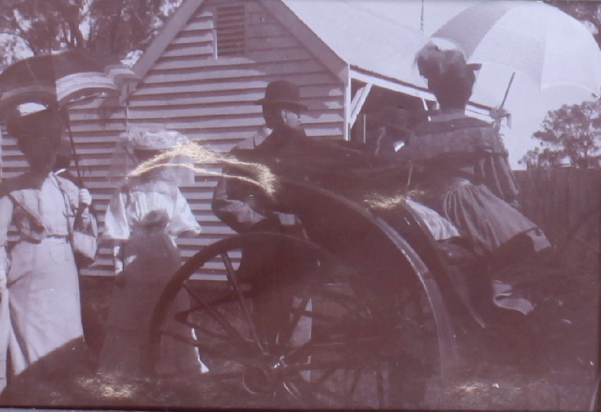Unidentified group near a buggy