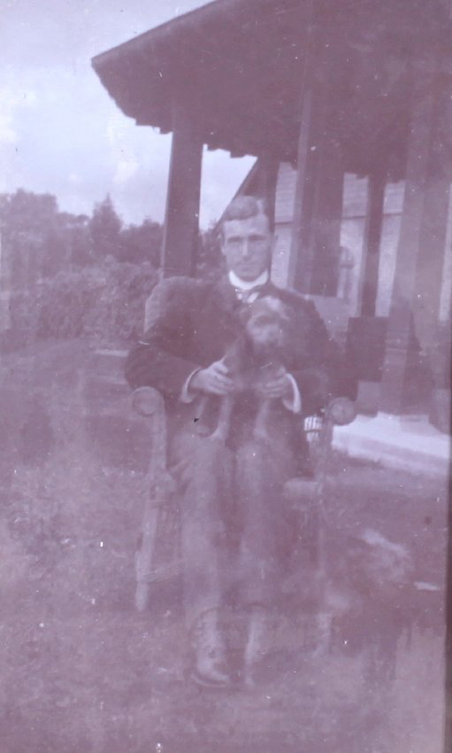 Unidentified man with pet dog