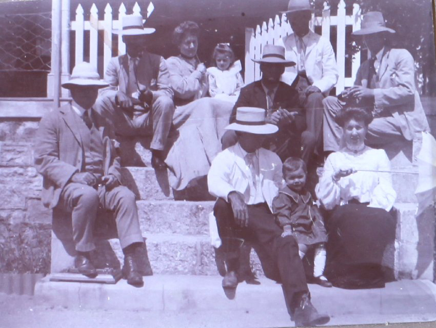 Unidentified group sitting on steps