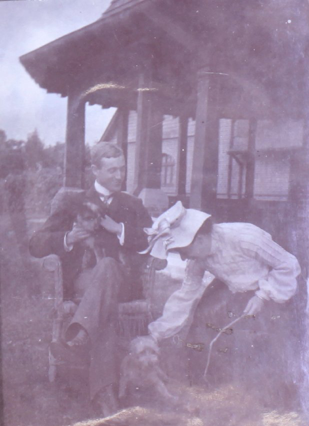 Unidentified couple with pet dogs