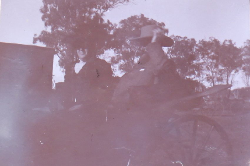Unidentified man and woman in a buggy