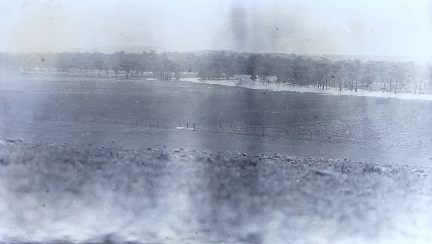 View of paddocks and flooded creek