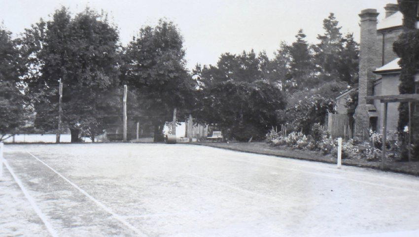 Tennis court, house and gardens at Saumarez
