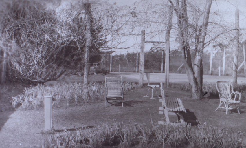 View of the gardens around the tennis court at Saumarez