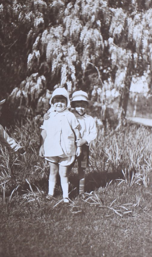Two unidentified children in the garden